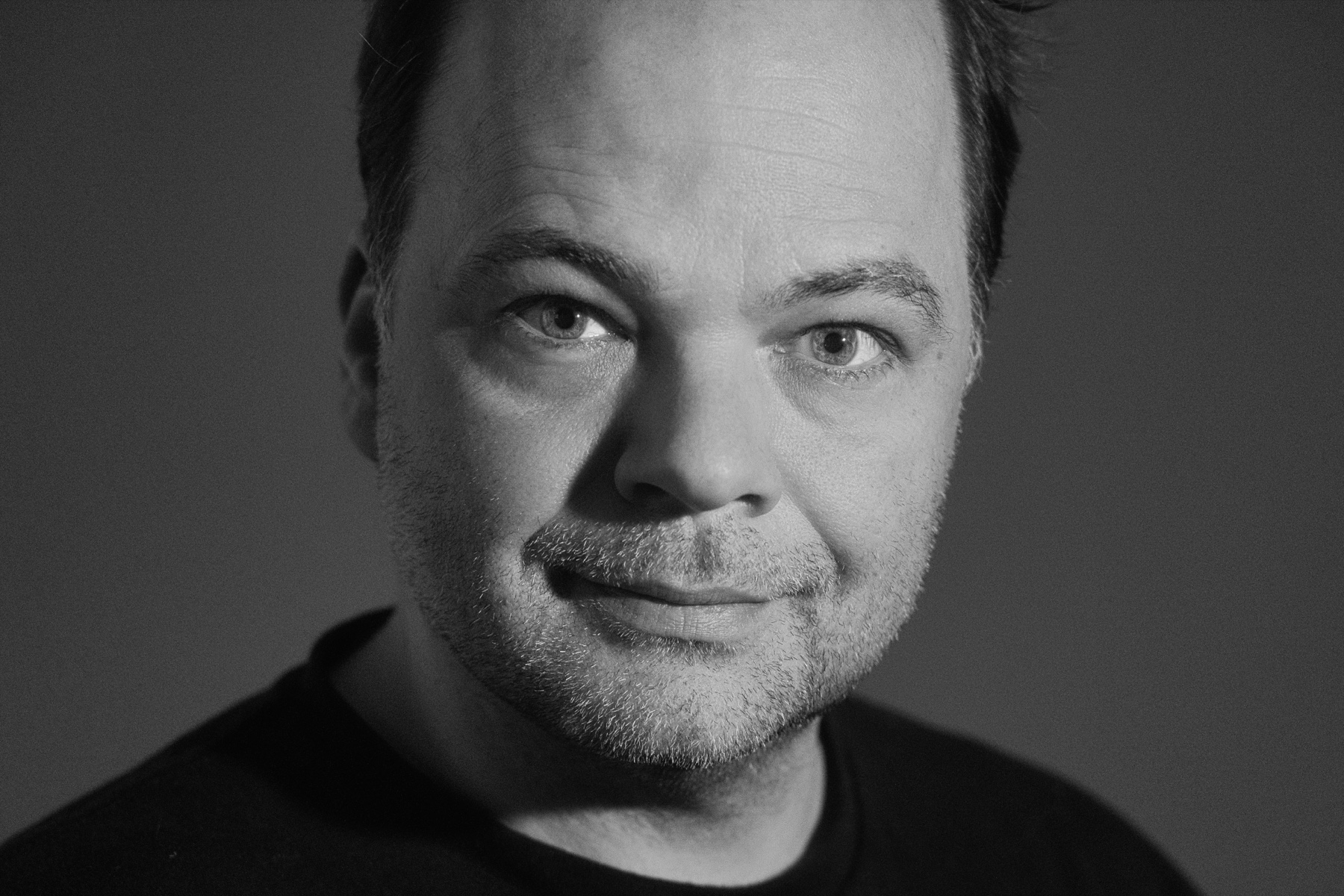 Black-and-white portrait of Laszlo Mezo, founder of MZ Picture & Sound