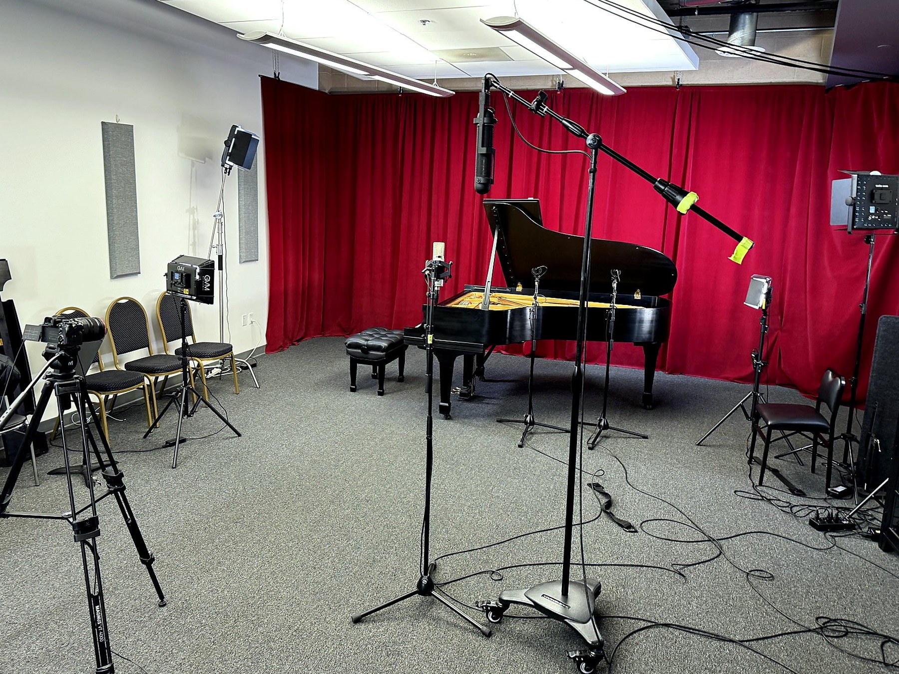 The real Irvine studio with grand piano, microphones and cinema lighting